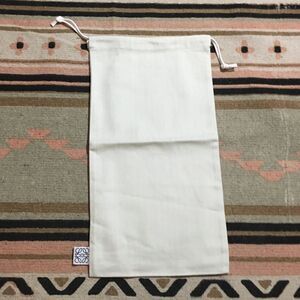 Loewe White Dustbag SMALL approx 14” x 8”
Good for travel 
Never used